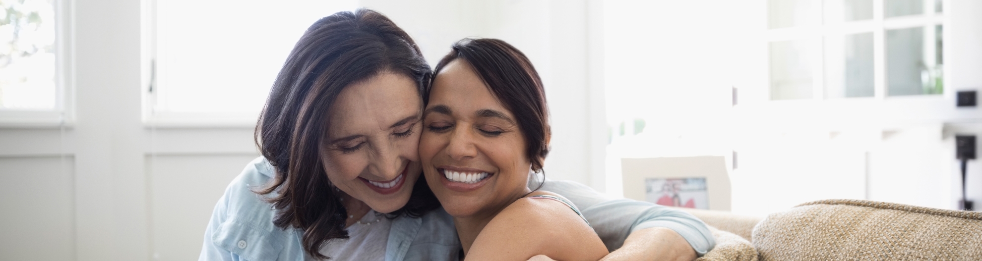 Mother Hugging Adult Daughter